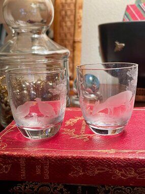 Vintage pair of frosted wildlife shot glasses.